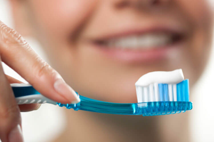 Dental hygienist performing an ultrasonic clean